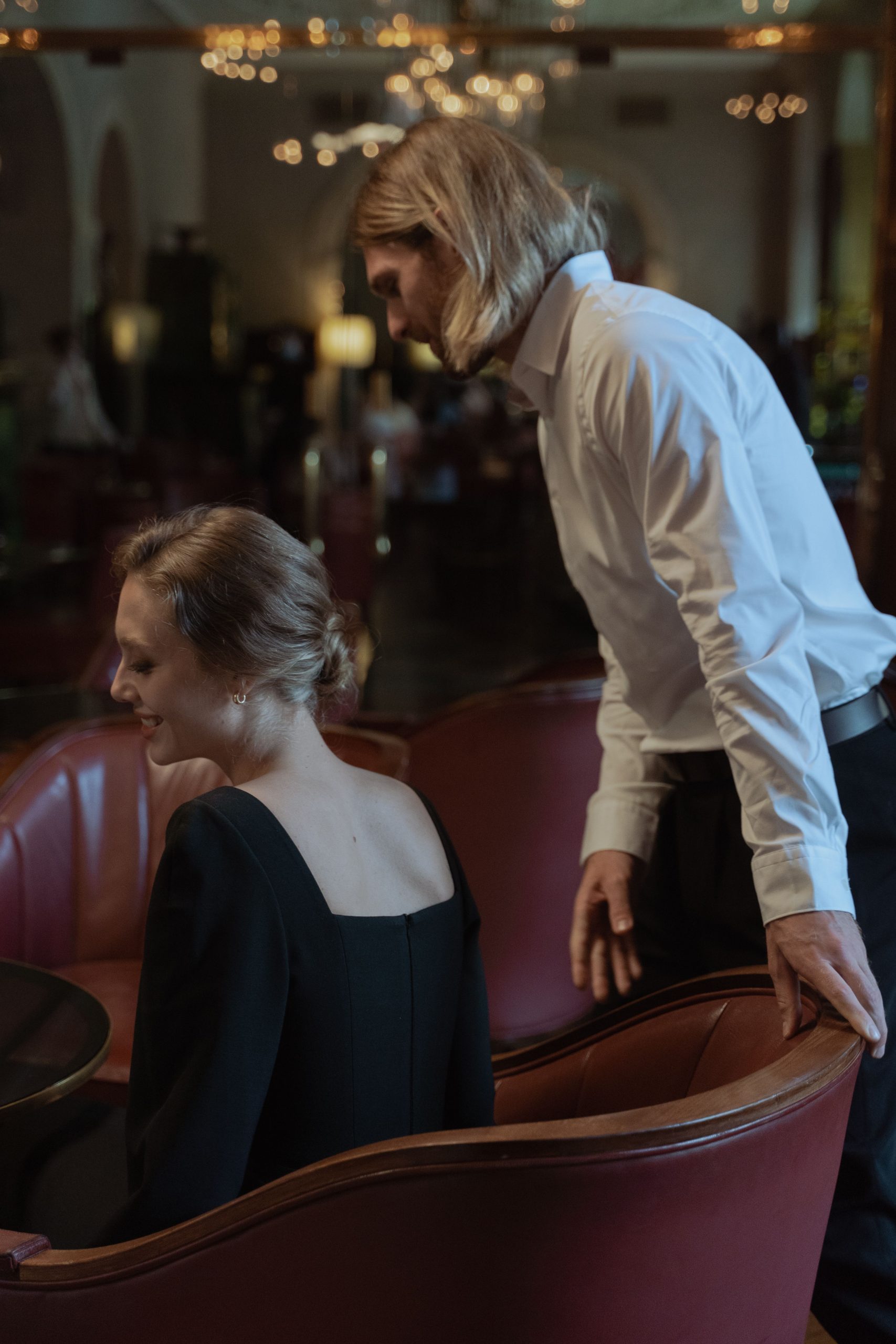 Elegant couple in evening wear enjoying an upscale restaurant date