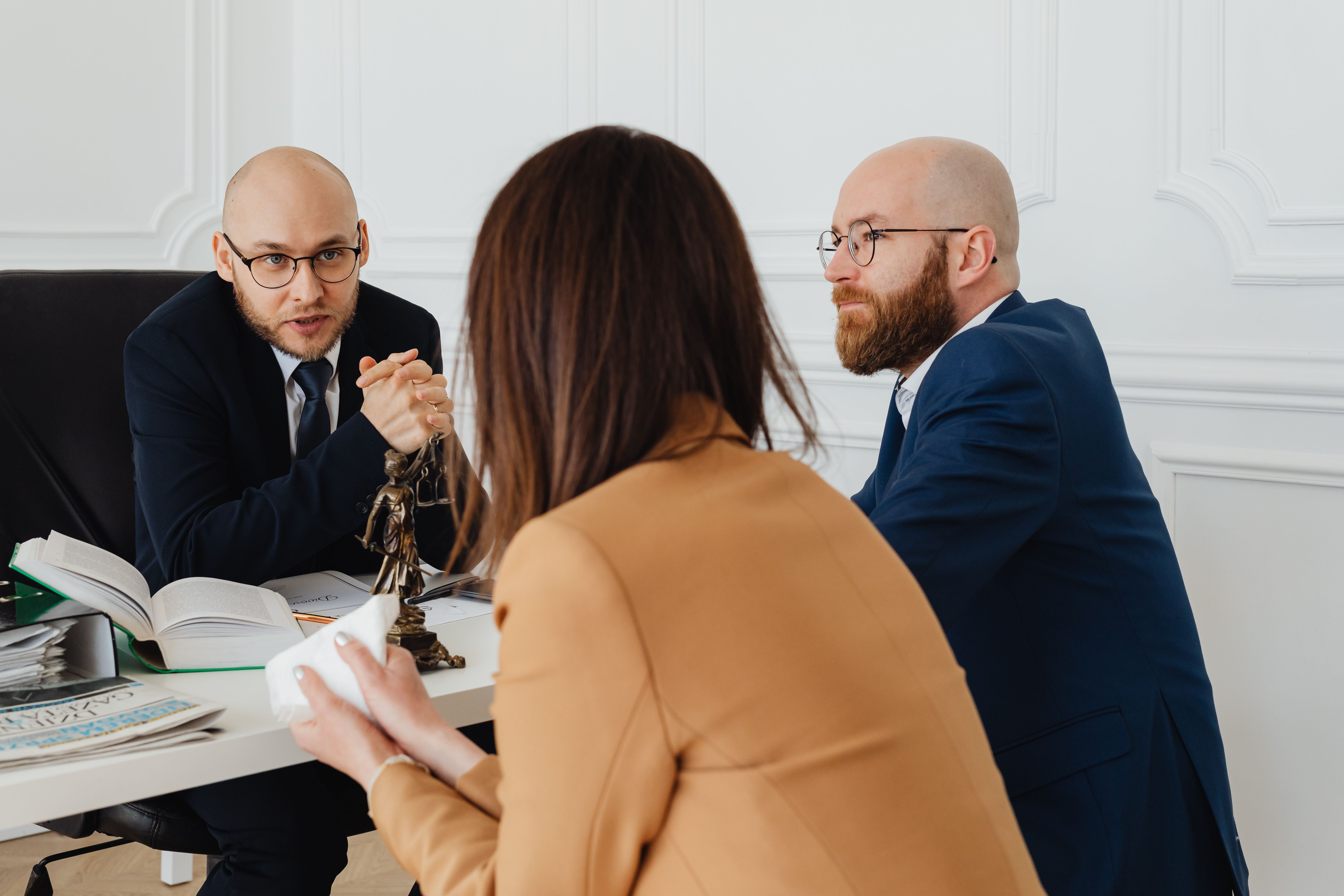 Legal professionals discussing a funded lawsuit in a modern law office